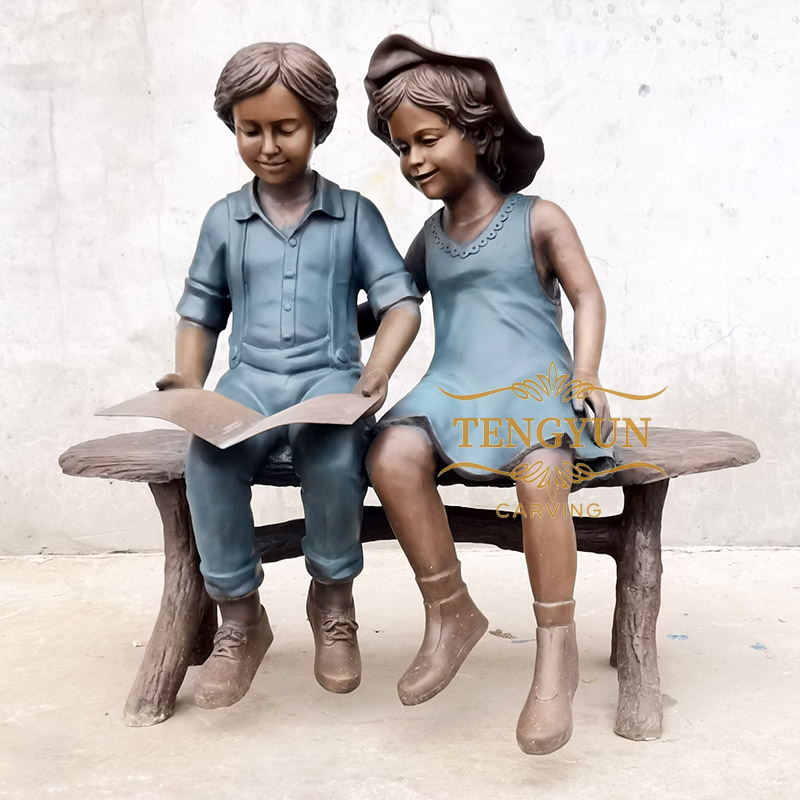 https://www.firststatue.com/life-size-boy-and-girl-sitting-on-bench-reading-sculpture-figure-read-statue-for-sale-product/