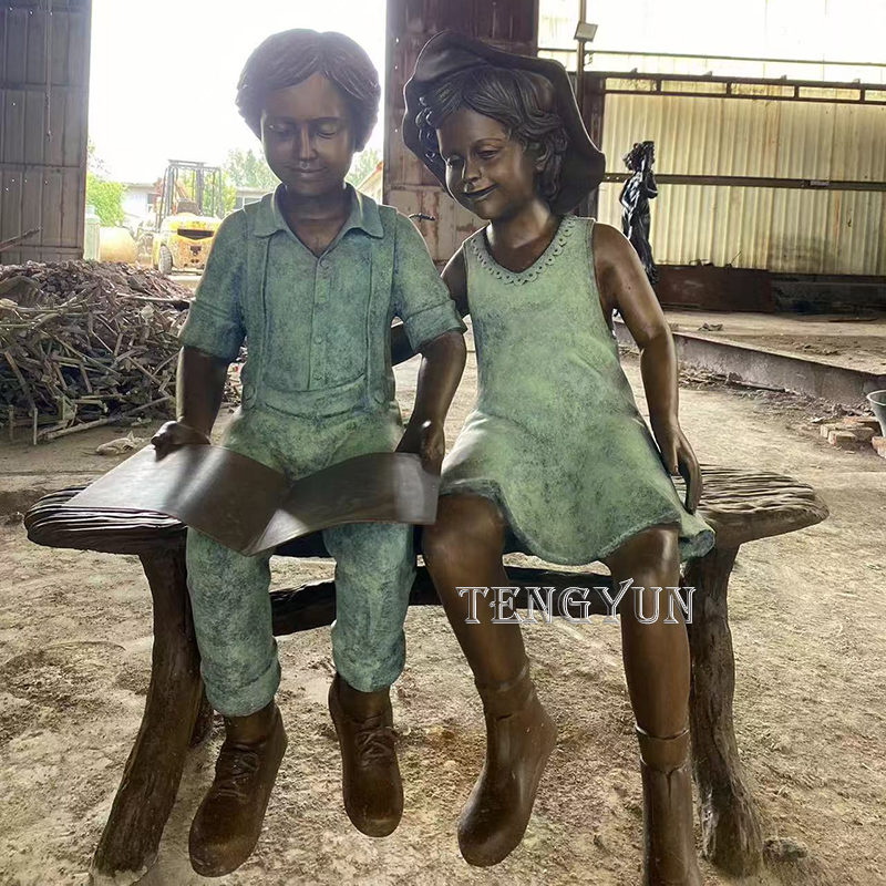 Life size bronze boy and girl read a book sculpture (2)