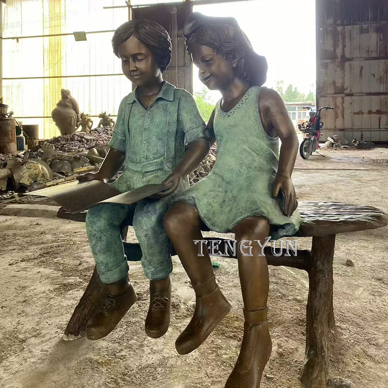 Life size bronze boy and girl read a book sculpture (4)