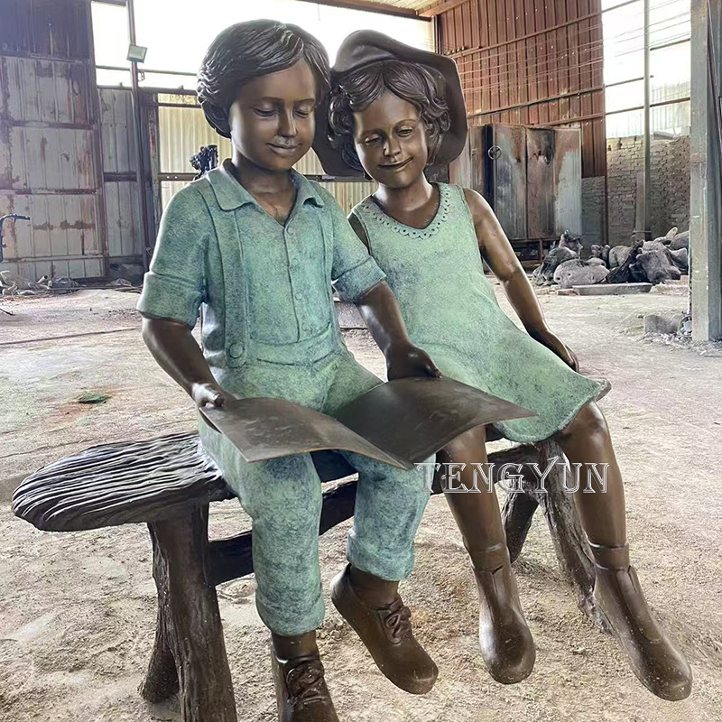 Life size bronze boy and girl read a book sculpture (5)