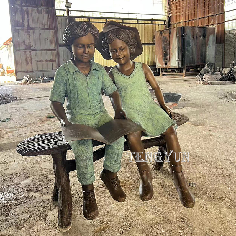 Life size bronze boy and girl read a book sculpture (6)