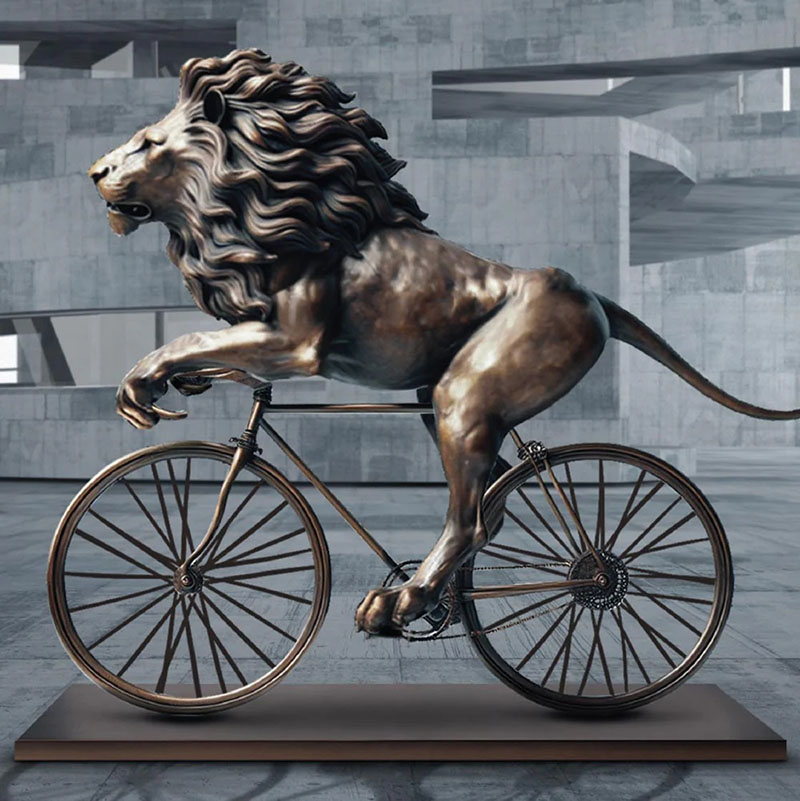 The lion rices on the bicycle bronze sculpture