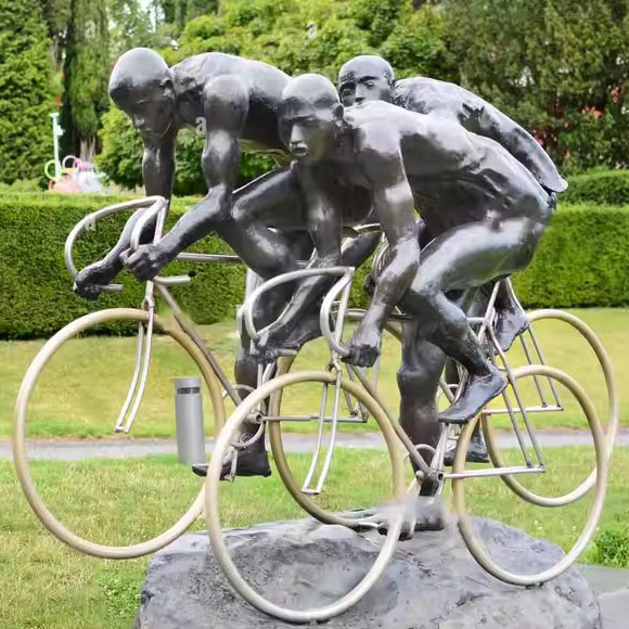 https://www.firststatue.com/outdoor-bronze-athletes-riding-bicycles-racing-statue-olympic-movement-sculpture-product/