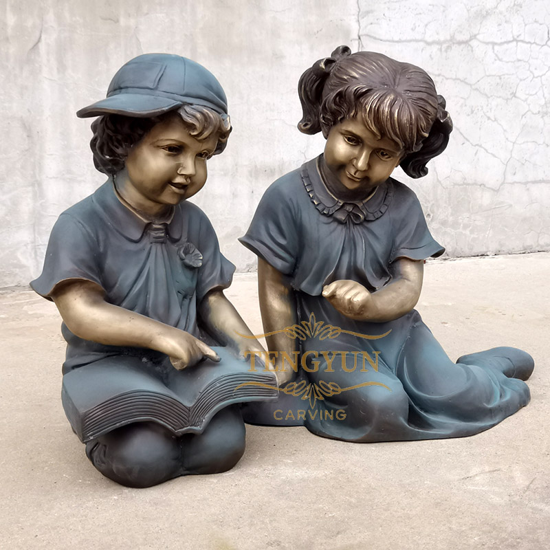 bronze boy and girl children reading statue (3)