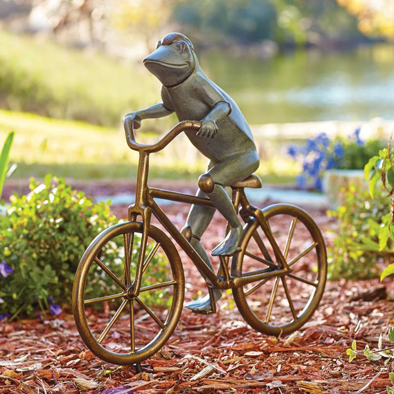 bronze frog ride a bike sculpture